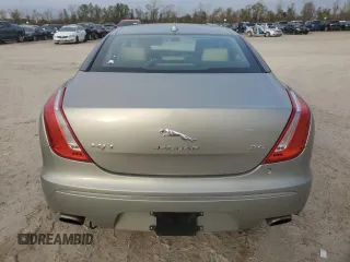 2014 Jaguar XJ with VIN SAJWA2GZ8E8V60138, listed as a Copart auction lot 86384064 with 137,190 mi miles and Salvage Title. Bid and sale history available at carsss.com. Image 6.