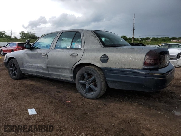 2004 Ford Police Interceptor with VIN 2FAHP71W14X138220, listed as a Copart auction lot 59930385 with 169,302 mi miles and Salvage title. Bid and sale history available at DreamBid. Image 2.