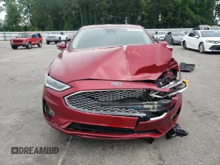 2019 Ford Fusion Titanium z VIN 3FA6P0D99KR221328, wystawiony jako Copart lot #57104515 z przebiegiem 138 427 mil mil oraz Szkoda całkowita • Salvage title. Historia ofert i sprzedaży dostępna na DreamBid. Obrazek 5.