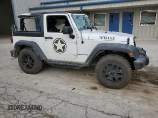 2017 Jeep Wrangler Willys Wheeler with VIN 1C4AJWAG7HL589574, listed as a Copart auction lot 79006504 with 117,075 mi miles and Salvage Title. Bid and sale history available at DreamBid. Image 4.