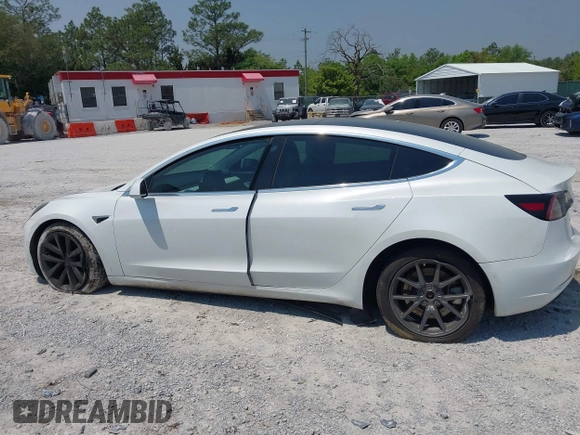 2019 Tesla Model 3 Long Range with VIN 5YJ3E1EB4KF494432, listed as a IAAI auction lot 42009327 with 121,954 mi miles and . Bid and sale history available at DreamBid. Image 14.