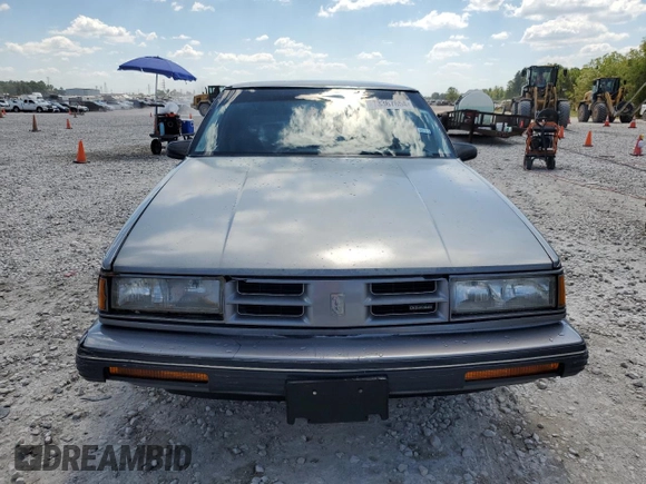 1991 Oldsmobile 88 z VIN 1G3HY54C4MH336805, wystawiony jako Copart lot #73367654 z przebiegiem 168 436 mil mil oraz Szkoda całkowita • Salvage title. Historia ofert i sprzedaży dostępna na DreamBid. Obrazek 5.