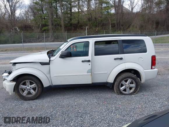 2007 Dodge Nitro SXT with VIN 1D8GU28K77W727391, listed as a IAAI auction lot 41869288 with 214,920 mi miles. Bid and sale history available at carsss.com. Image 14.