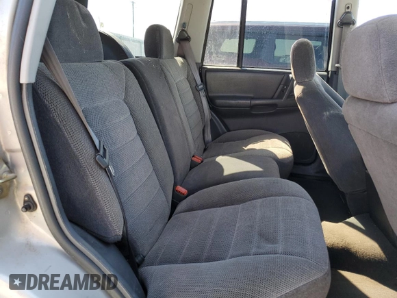 1997 Jeep Grand Cherokee Laredo with VIN 1J4GZ58S5VC561060, listed as a Copart auction lot 52098315 with 267,245 mi miles and Salvage title. Bid and sale history available at DreamBid. Image 11.