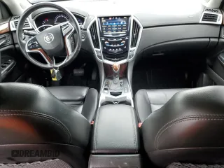 2015 Cadillac SRX Performance Collection with VIN 3GYFNCE38FS597717, listed as a Copart auction lot 57629615 with 102,689 mi miles and Salvage title. Bid and sale history available at DreamBid. Image 8.