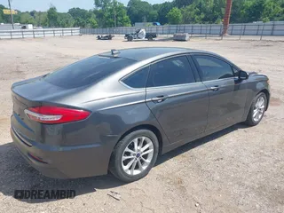 2020 Ford Fusion SE z VIN 3FA6P0H79LR118534, wystawiony jako IAAI lot #42065215 z przebiegiem 104 202 mil mil oraz . Historia ofert i sprzedaży dostępna na DreamBid. Obrazek 4.