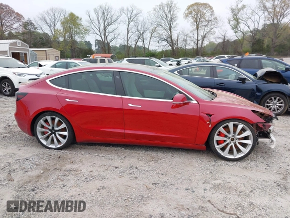 2018 Tesla Model 3 Long Range Battery with VIN 5YJ3E1EB7JF055384, listed as a IAAI auction lot 41924325 with 52,039 mi miles and . Bid and sale history available at DreamBid. Image 12.