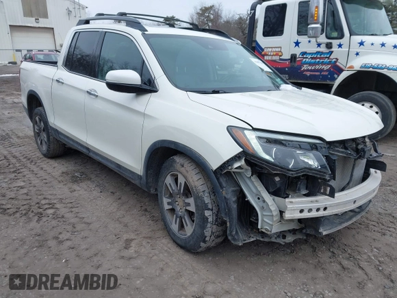 2019 Honda Ridgeline RTL-E z VIN 5FPYK3F77KB007879, wystawiony jako IAAI lot #41697569 z przebiegiem 80 215 mil mil oraz . Historia ofert i sprzedaży dostępna na DreamBid. Obrazek 1.