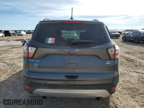 2018 Ford Escape SE with VIN 1FMCU9GD6JUB12810, listed as a Copart auction lot 82598864 with 138,640 mi miles and Salvage Title. Bid and sale history available at carsss.com. Image 6.