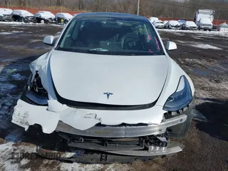 2023 Tesla Model 3 Long Range with VIN 5YJ3E1EBXPF392818, listed as a IAAI auction lot 41346835 with 31,750 mi miles and . Bid and sale history available at DreamBid. Image 12.