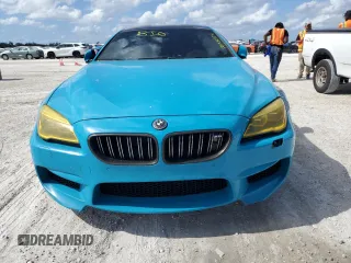 2016 BMW M6 z VIN WBS6E9C51GG437085, wystawiony jako Copart lot #78982124 z przebiegiem Nie podano mil oraz Szkody całkowita. Historia ofert i sprzedaży dostępna na DreamBid. Obrazek 5.