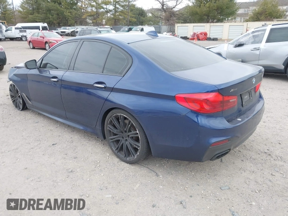 2018 BMW 5 Series M550i xDrive with VIN WBAJB9C56JG463891, listed as a IAAI auction lot 41731556 with 104,860 mi miles. Bid and sale history available at carsss.com. Image 3.