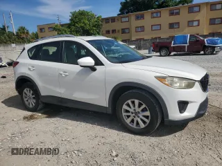 2014 Mazda CX-5 Sport with VIN JM3KE2BE9E0344990, listed as a Copart auction lot 59014145 with 126,905 mi miles and Salvage title. Bid and sale history available at DreamBid. Image 4.