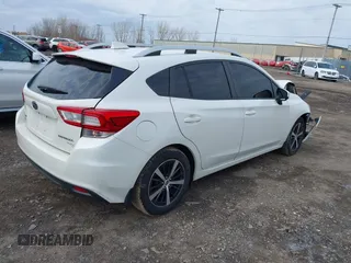 2019 Subaru Impreza Premium with VIN 4S3GTAC62K3704035, listed as a IAAI auction lot 42025822 with 76,067 mi miles and . Bid and sale history available at DreamBid. Image 4.