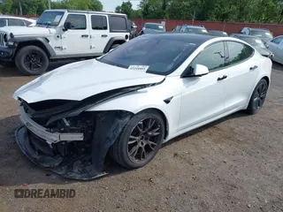 2022 Tesla Model S with VIN 5YJSA1E58NF467644, listed as a IAAI auction lot 42344403 with 52,628 mi miles and . Bid and sale history available at DreamBid. Image 2.