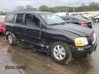 2004 GMC Envoy SLT with VIN 1GKDT13S042310076, listed as a Copart auction lot 79965854 with 220,506 mi miles and Salvage Title. Bid and sale history available at carsss.com. Image 4.