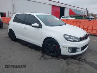 2012 Volkswagen GTI w/Sunroof & Navi PZEV z VIN WVWGD7AJXCW031311, wystawiony jako IAAI lot #41471879 z przebiegiem 101 989 mil mil oraz . Historia ofert i sprzedaży dostępna na DreamBid. Obrazek 1.