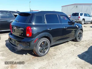 2015 MINI Countryman S with VIN WMWZC3C5XFWT04916, listed as a IAAI auction lot 41636369 with 101,448 mi miles and . Bid and sale history available at DreamBid. Image 4.