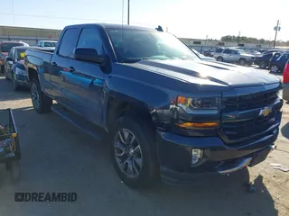 2017 Chevrolet Silverado 1500 LT with VIN 1GCVKRECXHZ154083, listed as a IAAI auction lot 41216478 with 153,599 mi miles. Bid and sale history available at carsss.com. Image 1.