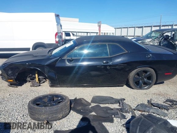 2014 Dodge Challenger R/T Plus z VIN 2C3CDYBT2EH274265, wystawiony jako IAAI lot #41845052 z przebiegiem 120 290 mil mil oraz . Historia ofert i sprzedaży dostępna na DreamBid. Obrazek 14.
