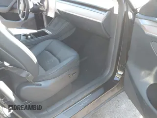 2023 Tesla Model Y Long Range with VIN 7SAYGAEE3PF925928, listed as a IAAI auction lot 41753910 with Not provided miles and . Bid and sale history available at DreamBid. Image 5.