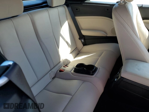 2016 BMW 2 Series 228i with VIN WBA1K9C50GV710942, listed as a Copart auction lot 77700934 with 28,643 mi miles and Salvage Title. Bid and sale history available at carsss.com. Image 10.