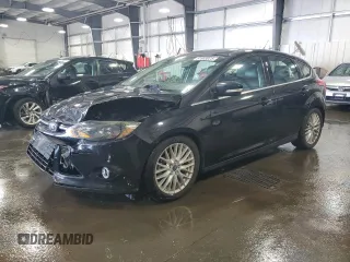 2014 Ford Focus Titanium with VIN 1FADP3N2XEL131392, listed as a Copart auction lot 61665025 with 105,597 mi miles and Salvage title. Bid and sale history available at DreamBid. Image 1.