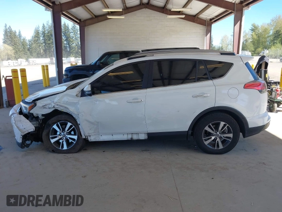 2018 Toyota RAV4 XLE with VIN JTMRFREVXJD240388, listed as a IAAI auction lot 42052065 with 117,114 mi miles. Bid and sale history available at carsss.com. Image 15.