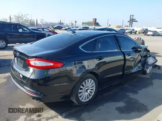 2013 Ford Fusion SE Hybrid with VIN 3FA6P0LU4DR325699, listed as a IAAI auction lot 41677237 with 129,004 mi miles. Bid and sale history available at carsss.com. Image 4.