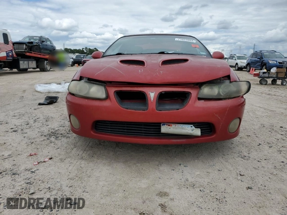 2006 Pontiac GTO z VIN 6G2VX12U66L564449, wystawiony jako Copart lot #71022094 z przebiegiem 179 964 mil mil oraz Szkody całkowita. Historia ofert i sprzedaży dostępna na DreamBid. Obrazek 5.