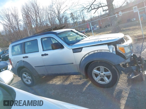 2007 Dodge Nitro SXT with VIN 1D8GU28K67W740794, listed as a IAAI auction lot 41591855 with 162,709 mi miles. Bid and sale history available at carsss.com. Image 14.