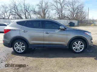 2013 Hyundai Santa Fe Sport z VIN 5XYZWDLA1DG003779, wystawiony jako IAAI lot #41761431 z przebiegiem 127 895 mil mil oraz . Historia ofert i sprzedaży dostępna na DreamBid. Obrazek 13.