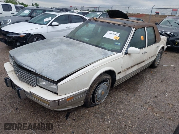 1990 Cadillac Seville z VIN 1G6KY533XLU803161, wystawiony jako IAAI lot #42164352 z przebiegiem Nie podano mil oraz . Historia ofert i sprzedaży dostępna na DreamBid. Obrazek 2.
