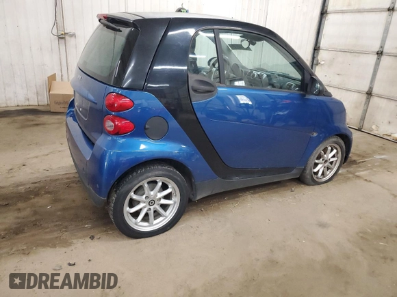 2009 Smart fortwo Pure z VIN WMEEJ31X99K209790, wystawiony jako Copart lot #51102685 z przebiegiem 30 389 mil mil oraz Szkody całkowita. Historia ofert i sprzedaży dostępna na DreamBid. Obrazek 3.