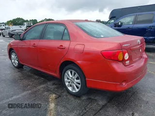 2009 Toyota Corolla with VIN 1NXBU40E39Z022074, listed as a IAAI auction lot 41987902 with 121,206 mi miles. Bid and sale history available at carsss.com. Image 3.