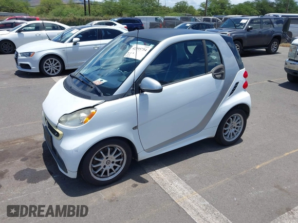 2013 Smart fortwo Pure with VIN WMEEJ3BA8DK605597, listed as a IAAI auction lot 42395754 with 55,637 mi miles and . Bid and sale history available at DreamBid. Image 2.