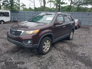 2011 Kia Sorento LX with VIN 5XYKT3A1XBG147240, listed as a IAAI auction lot 42465947 with 112,150 mi miles and . Bid and sale history available at DreamBid. Image 2.