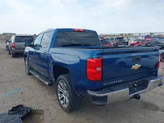 2018 Chevrolet Silverado 1500 LT with VIN 3GCPCREH1JG125997, listed as a IAAI auction lot 41884888 with 122,406 mi miles and . Bid and sale history available at DreamBid. Image 3.