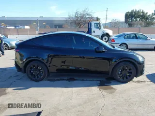 2024 Tesla Model Y Long Range with VIN 7SAYGDEEXRF983040, listed as a IAAI auction lot 41555332 with 79,506 mi miles and . Bid and sale history available at DreamBid. Image 13.