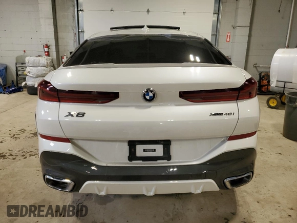 2020 BMW X6 xDrive40i z VIN 5UXCY6C07L9B43453, wystawiony jako Copart lot #52096845 z przebiegiem Nie podano mil oraz Szkoda całkowita • Salvage title. Historia ofert i sprzedaży dostępna na DreamBid. Obrazek 6.
