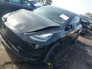 2023 Tesla Model Y Long Range z VIN 7SAYGAEE5PF603128, wystawiony jako IAAI lot #41328797 z przebiegiem 63 527 mil mil oraz . Historia ofert i sprzedaży dostępna na DreamBid. Obrazek 20.