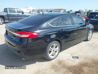 2018 Ford Fusion SE z VIN 3FA6P0H74JR125761, wystawiony jako IAAI lot #41992708 z przebiegiem 102 242 mil mil oraz . Historia ofert i sprzedaży dostępna na DreamBid. Obrazek 4.