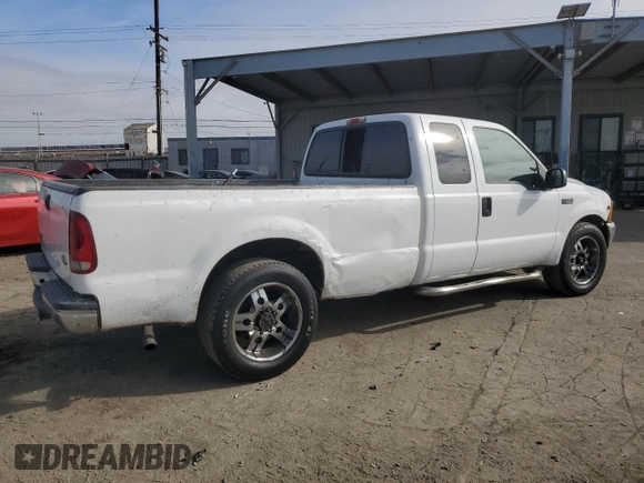 2001 Ford Super Duty F-250 XL with VIN 1FTNX20LX1EA37939, listed as a Copart auction lot 82408314 with 303,527 mi miles and Salvage Title. Bid and sale history available at carsss.com. Image 3.
