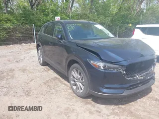 2021 Mazda CX-5 Grand Touring with VIN JM3KFBDM5M1378497, listed as a IAAI auction lot 42081730 with 35,040 mi miles and . Bid and sale history available at DreamBid. Image 1.
