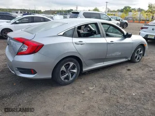 2019 Honda Civic Sedan LX with VIN 2HGFC2F65KH586106, listed as a IAAI auction lot 40486735 with 82,714 mi miles. Bid and sale history available at carsss.com. Image 4.