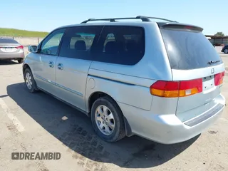2003 Honda Odyssey EX with VIN 2HKRL18603H502236, listed as a IAAI auction lot 41929501 with 287,538 mi miles and . Bid and sale history available at DreamBid. Image 3.