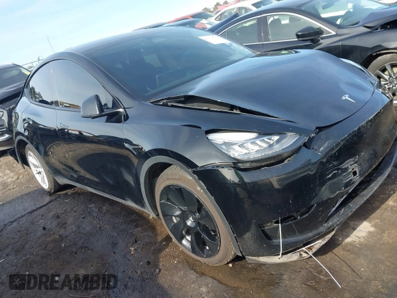 2023 Tesla Model Y Long Range z VIN 7SAYGAEE5PF603128, wystawiony jako IAAI lot #41328797 z przebiegiem 63 527 mil mil oraz . Historia ofert i sprzedaży dostępna na DreamBid. Obrazek 1.