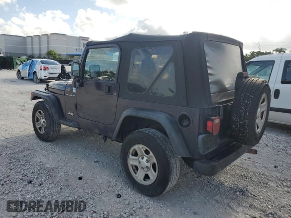 1998 Jeep Wrangler SE with VIN 1J4FY29P6WP705491, listed as a Copart auction lot 61873695 with 195,678 mi miles and Clean title. Bid and sale history available at DreamBid. Image 2.