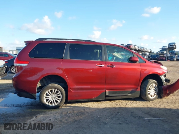 2014 Toyota Sienna XLE with VIN 5TDYK3DCXES473671, listed as a IAAI auction lot 42243030 with 70,052 mi miles and . Bid and sale history available at DreamBid. Image 13.