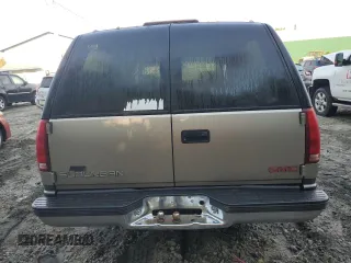 1999 GMC Suburban z VIN 3GKEC16R4XG536985, wystawiony jako Copart lot #73421824 z przebiegiem 181 327 mil mil oraz Tytuł czysty. Historia ofert i sprzedaży dostępna na DreamBid. Obrazek 6.